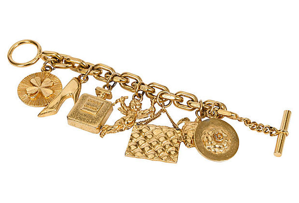 Louis Vuitton Gold Charm Bracelet  Gold charm bracelet, Vintage charm  bracelet, Louis vuitton jewelry