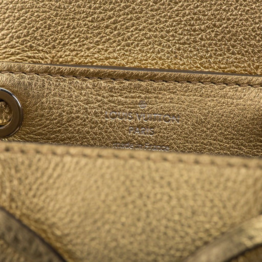 Louis Vuitton Gold Lockme Backpack