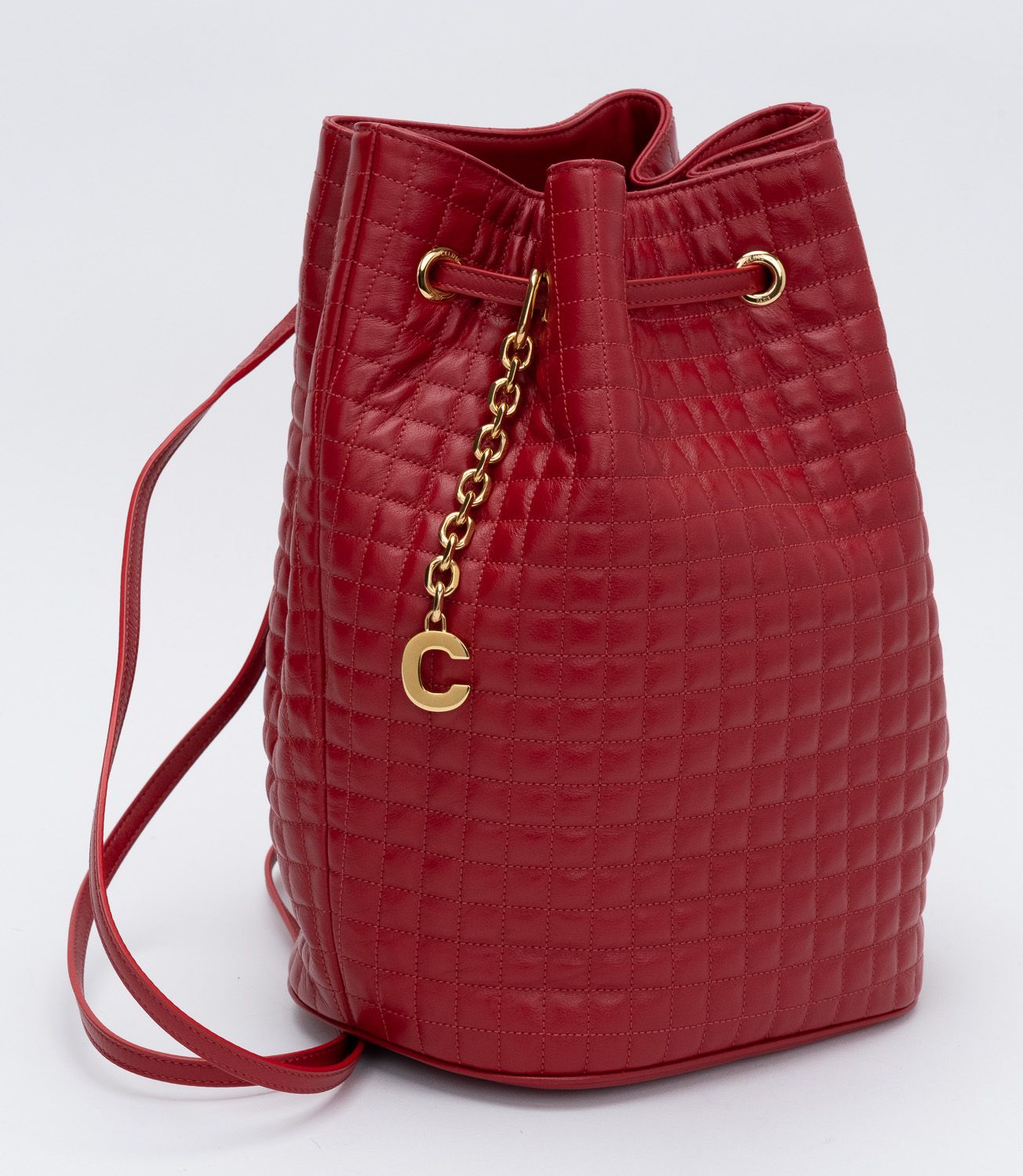 celine red quilted leather small backpack Cline Small C Charm Backpack In Quilted Calfskin With A Drawstring Closure Embellished With A Removable C Charm Celine New Red Leather Backpack